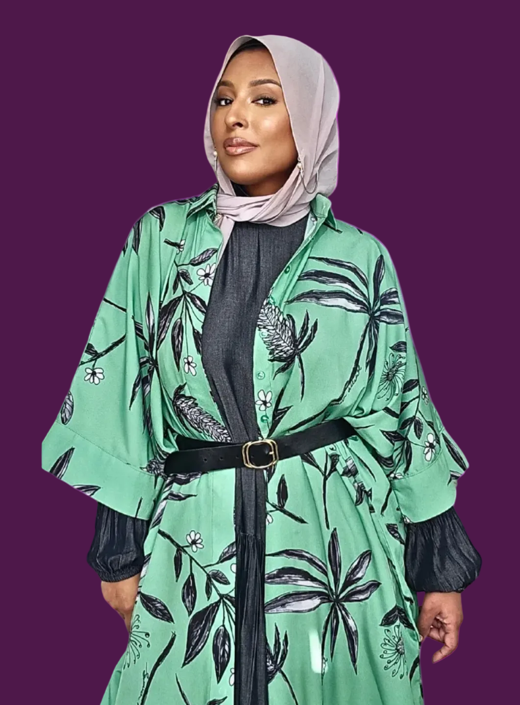 Samina Malik founder of Maeisonali wearing a green floral kimono shirt over a dress and belted